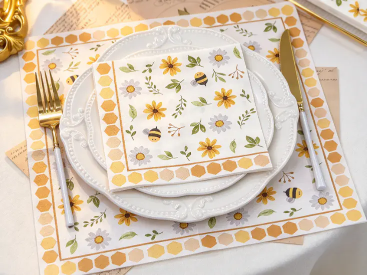 Party paper napkins with floral bee design, presented for coordinated table settings birthdays holidays and family gatherings.
